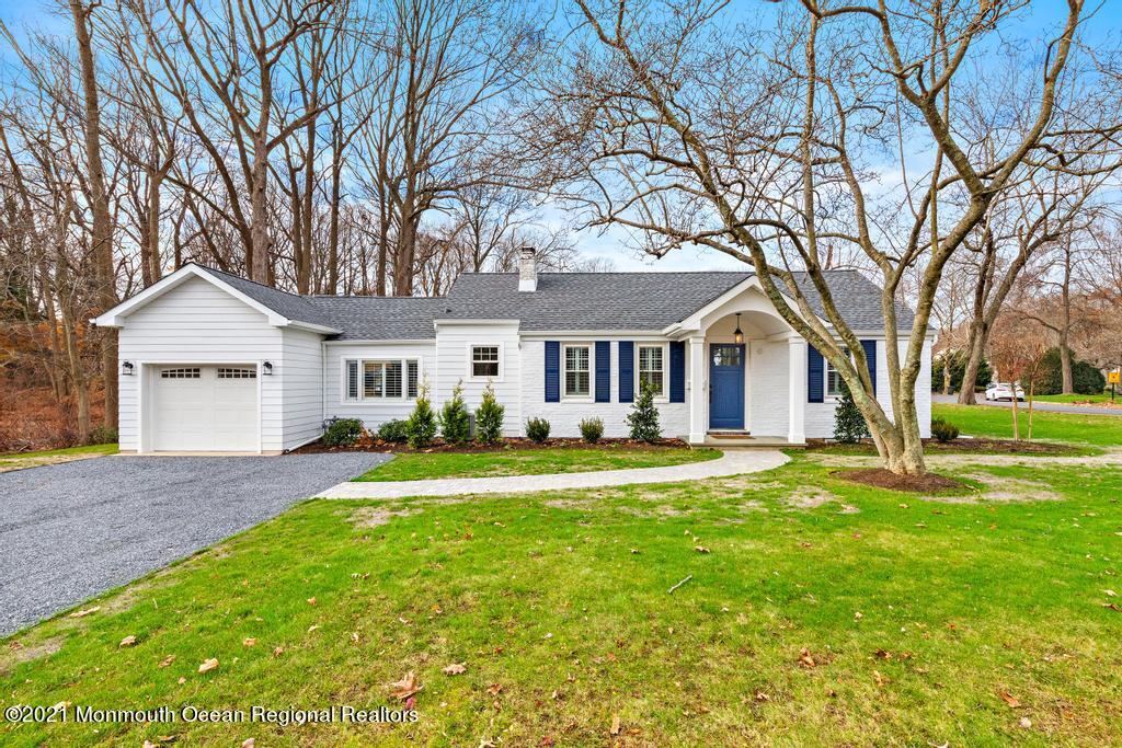 495 Branch Avenue Little Silver, NJ 07739 - Photo 1 of 26 a front view of a house with a yard and trees