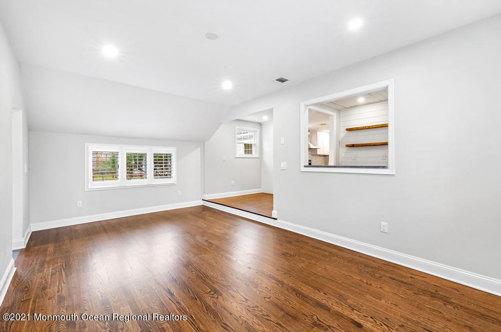 495 Branch Avenue Little Silver, NJ 07739 - Photo 15 of 26 an empty room with wooden floor and windows