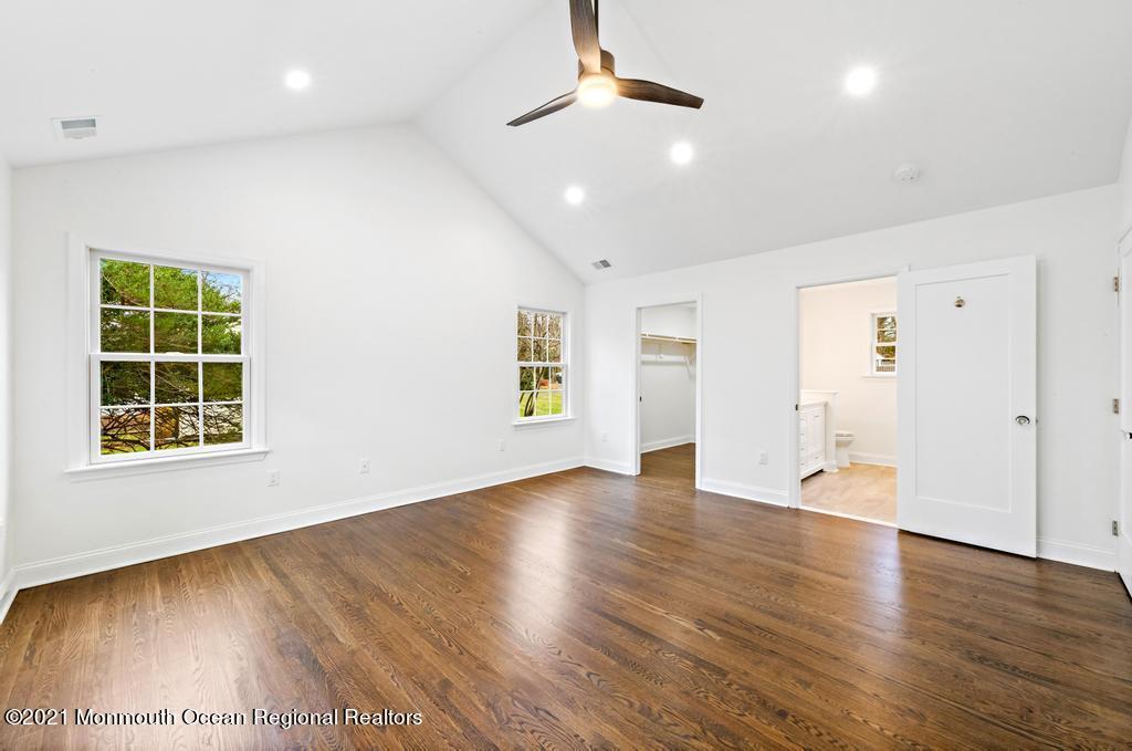 495 Branch Avenue Little Silver, NJ 07739 - Photo 16 of 26 an empty room with wooden floor and windows