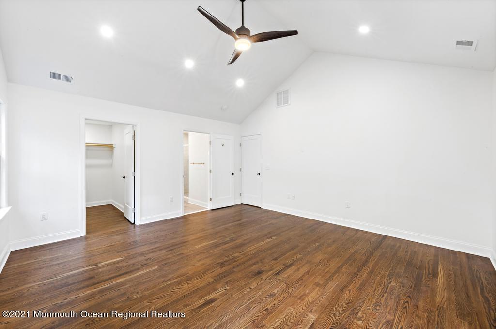 495 Branch Avenue Little Silver, NJ 07739 - Photo 17 of 26 an empty room with wooden floor and windows