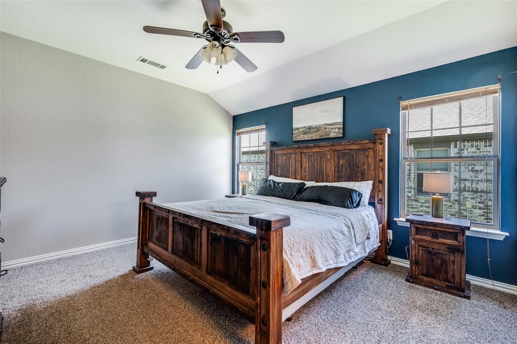 508 Copenhavr Street Pilot Point, TX 76258 - Photo 14 of 25 a bed sitting in a room next to a window