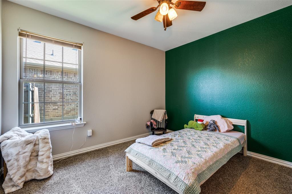 508 Copenhavr Street Pilot Point, TX 76258 - Photo 17 of 25 a bedroom with a bed and a window