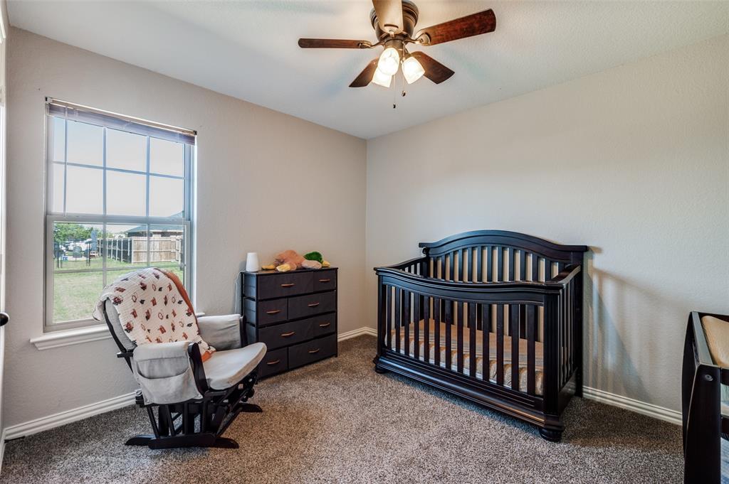 508 Copenhavr Street Pilot Point, TX 76258 - Photo 18 of 25 a bedroom with furniture and a window