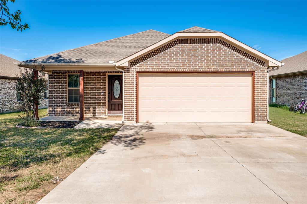 508 Copenhavr Street Pilot Point, TX 76258 - Photo 2 of 25 a view of front of a house with a porch