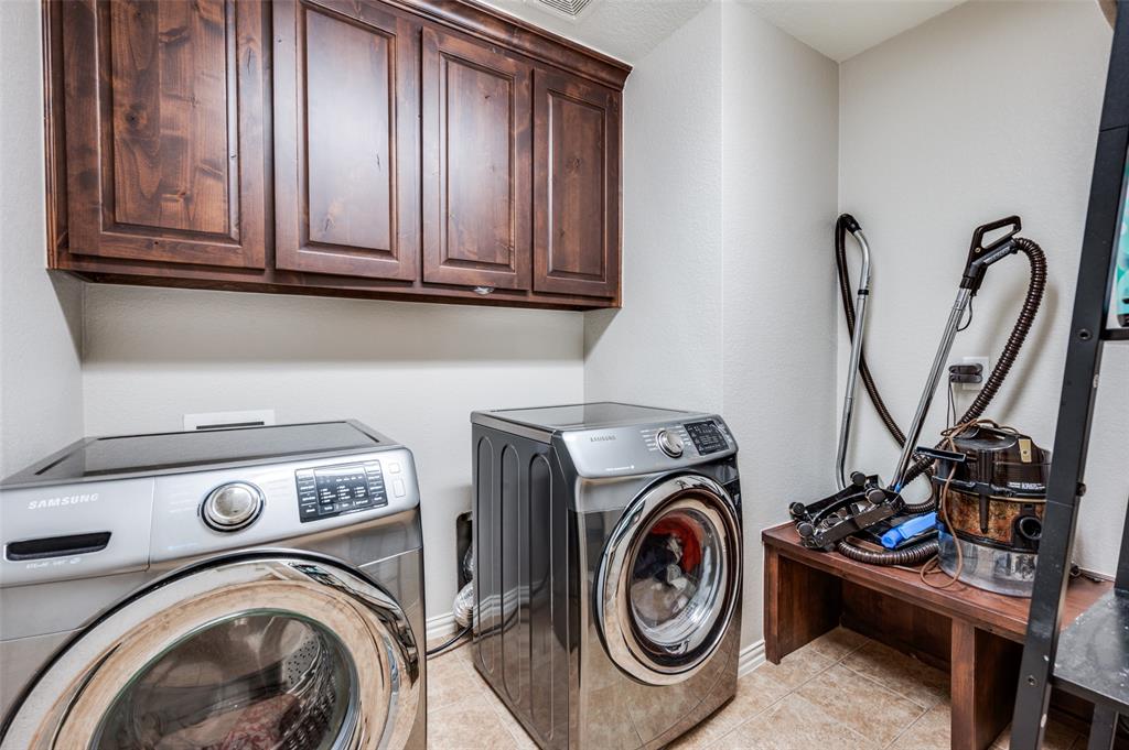 508 Copenhavr Street Pilot Point, TX 76258 - Photo 22 of 25 a view of storage and utility room with washer and dryer