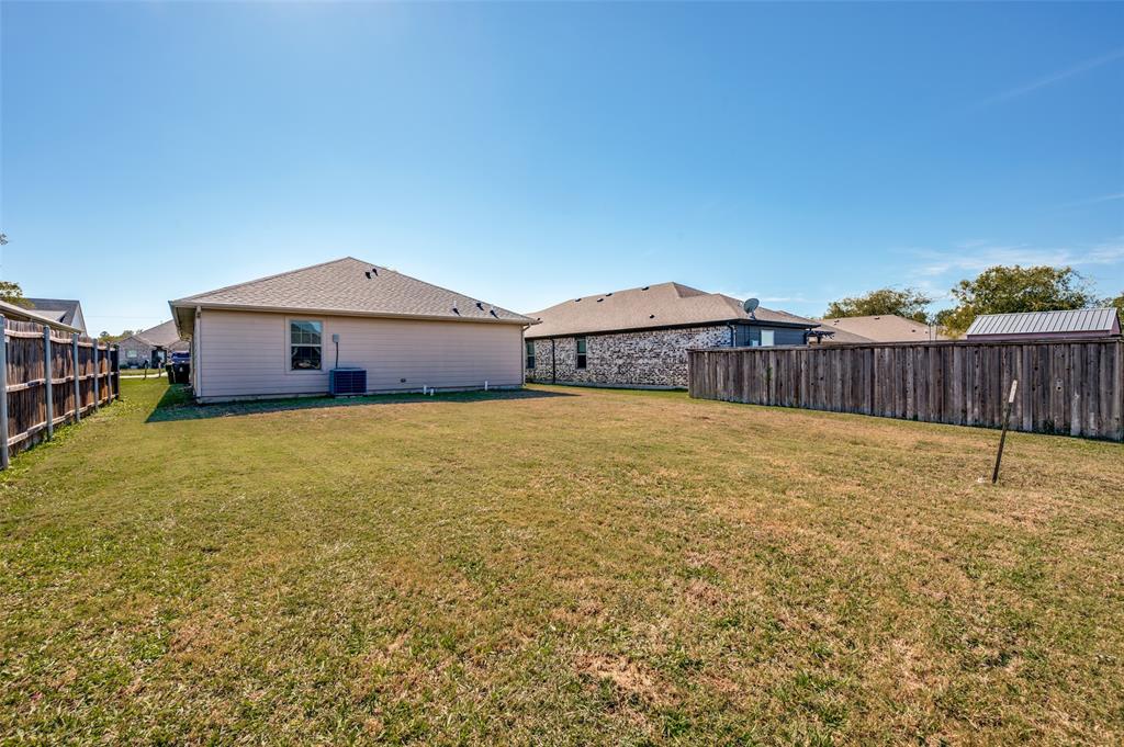 508 Copenhavr Street Pilot Point, TX 76258 - Photo 25 of 25 a view of a house with a yard