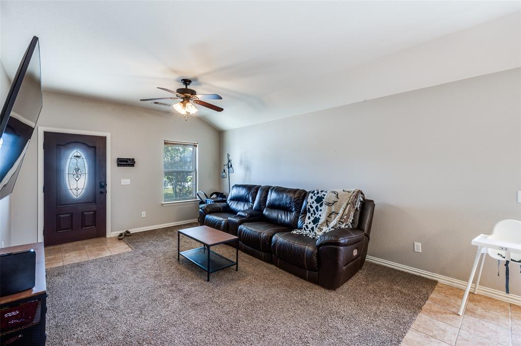 508 Copenhavr Street Pilot Point, TX 76258 - Photo 3 of 25 a living room with furniture and a ceiling fan
