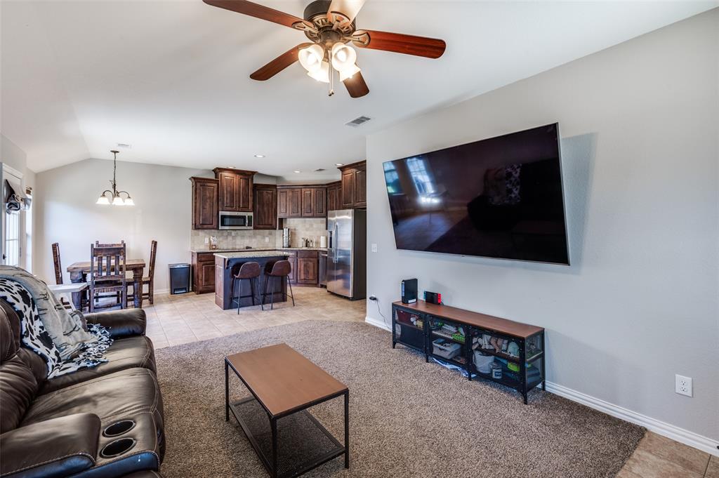 508 Copenhavr Street Pilot Point, TX 76258 - Photo 6 of 25 a living room with furniture and a flat screen tv