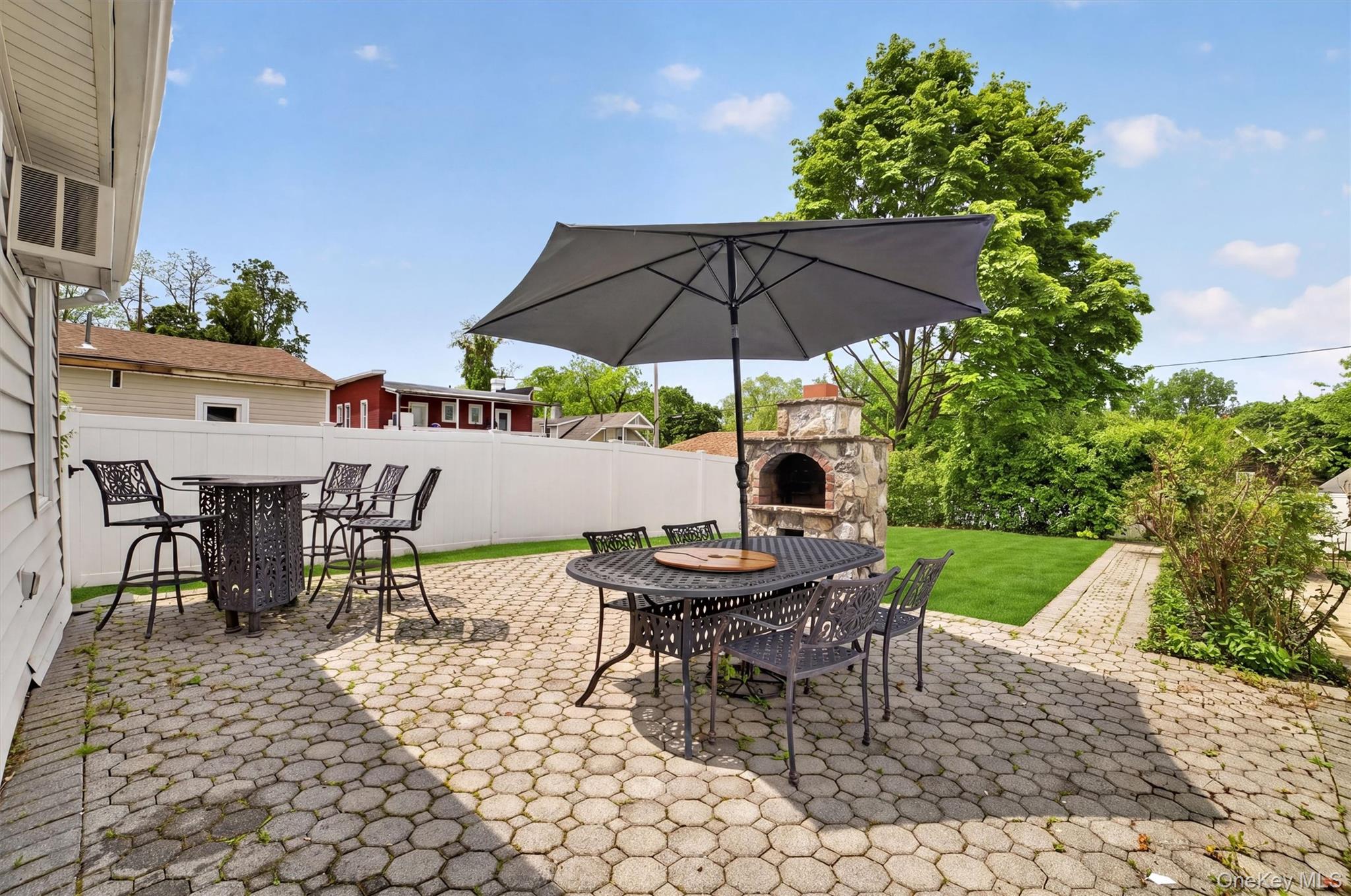 658 Ridge Street Peekskill, NY 10566 - Photo 34 of 44 Expansive paver patio featuring a built-in stone oven and a dedicated pathway
