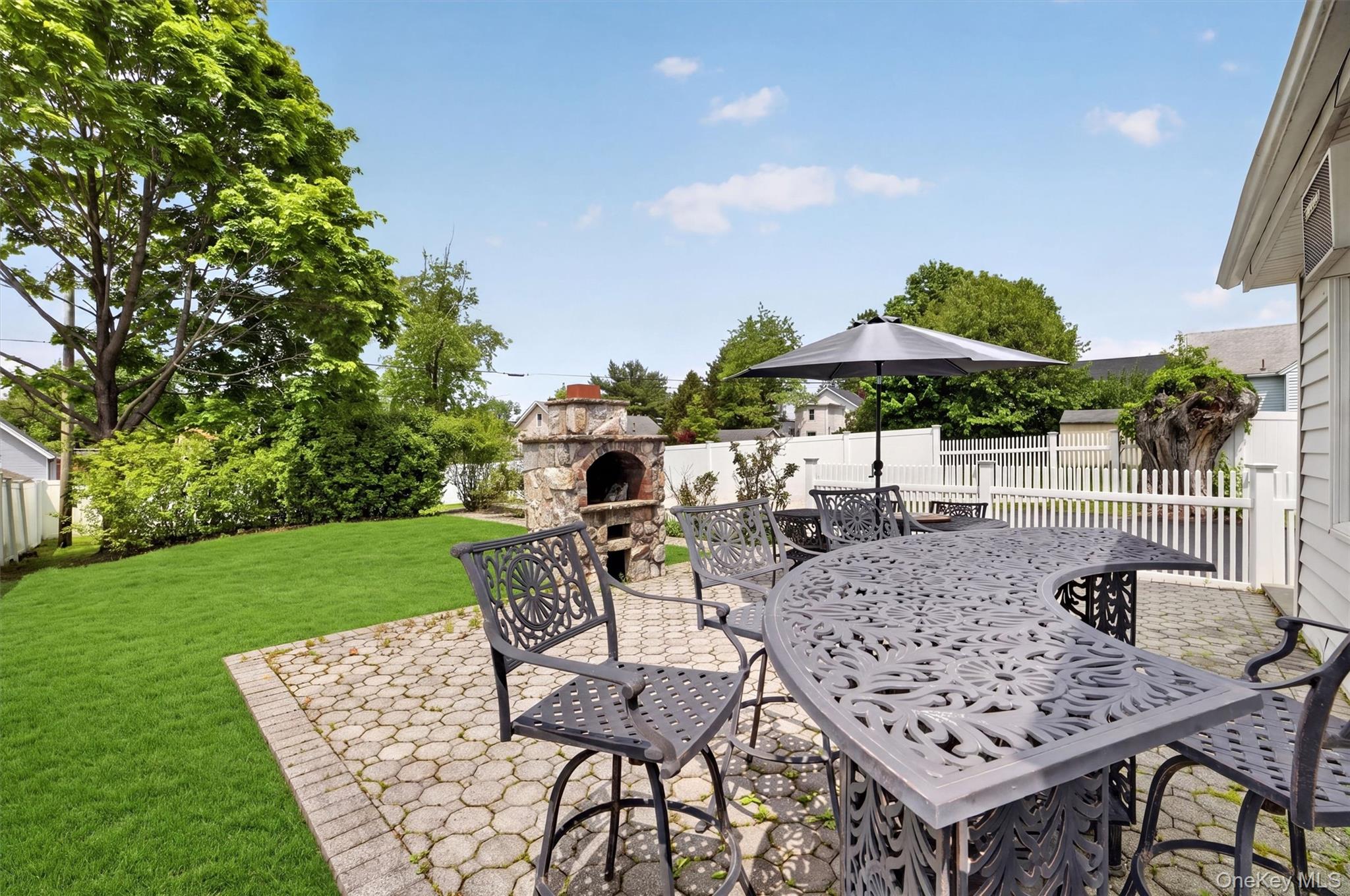 658 Ridge Street Peekskill, NY 10566 - Photo 36 of 44 Expansive paver patio featuring a built-in stone oven and a dedicated pathway