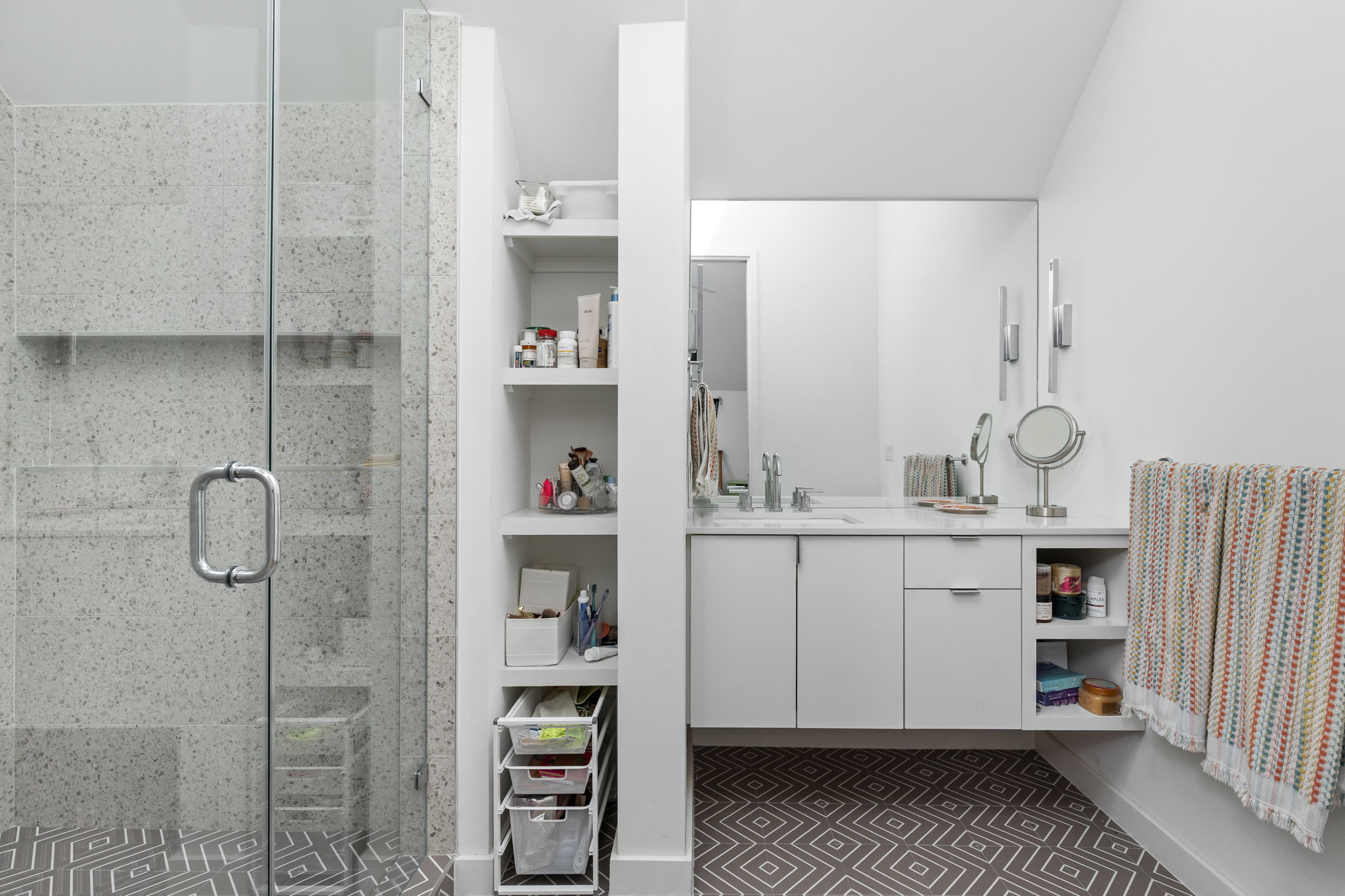 7502 St Louis Street Austin, TX 78757 - Photo 24 of 38 Bathroom with vanity and a stall shower