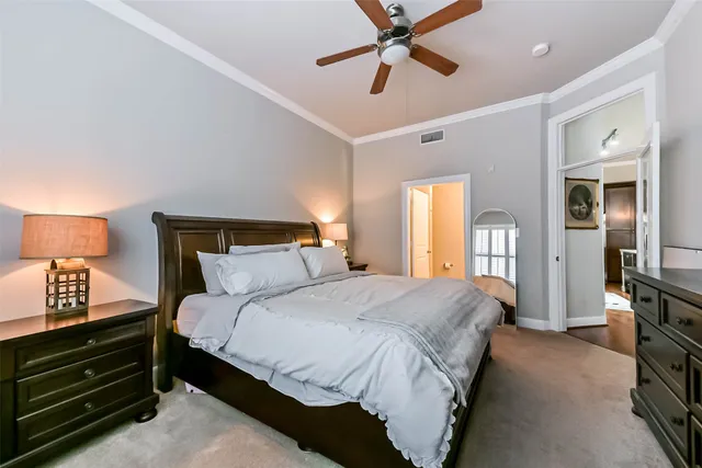 a en suite bathroom with 2 sink tub and a mirror