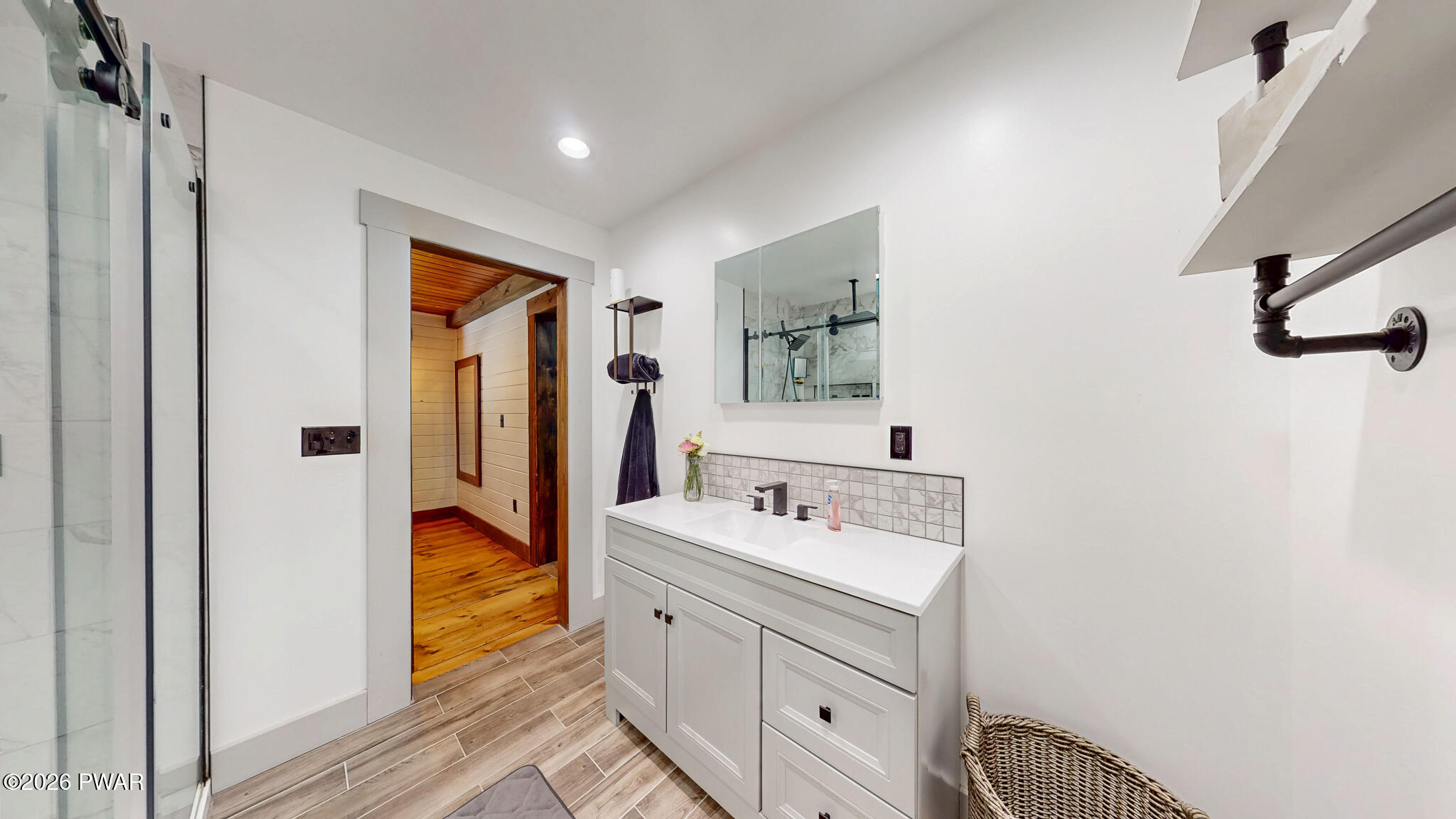 149 Sheards Road Milanville, PA 18443 - Photo 32 of 57 a bathroom with a sink and a mirror