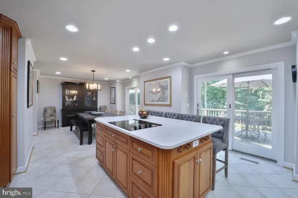 a kitchen with stainless steel appliances a refrigerator sink and window