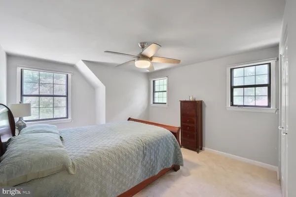 a view of a workspace with furniture and wooden floor