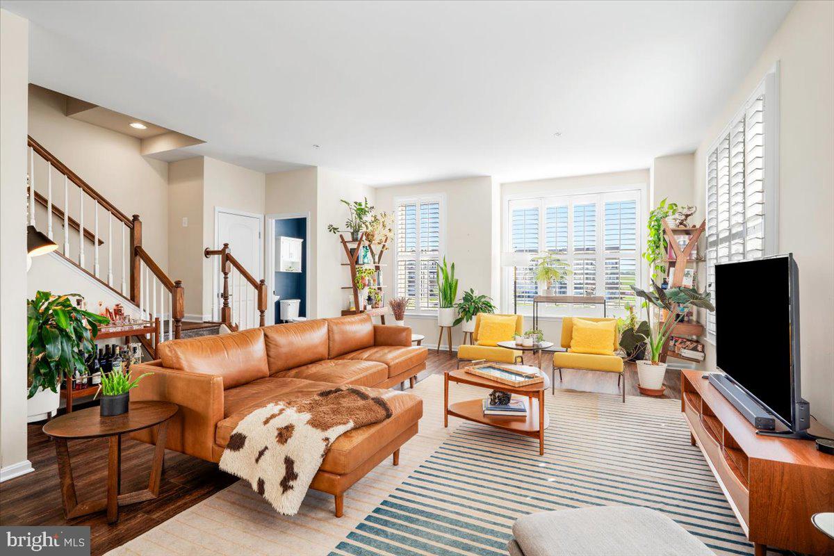 6500 Newton Drive Frederick, MD 21703 - Photo 11 of 36 a living room with furniture flat screen tv and a large window