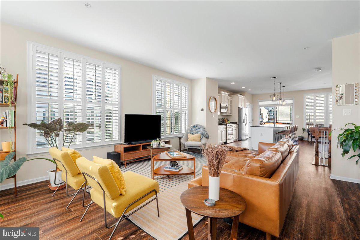 6500 Newton Drive Frederick, MD 21703 - Photo 12 of 36 a living room with fireplace furniture and a flat screen tv