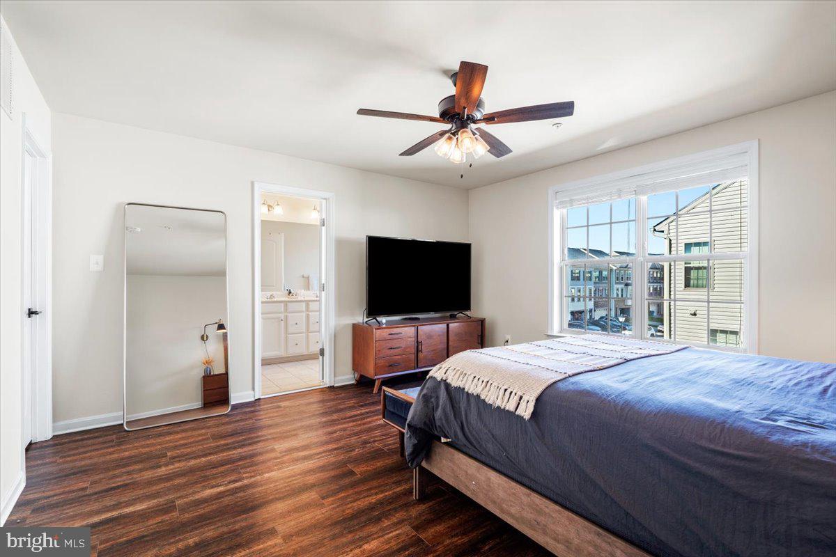 6500 Newton Drive Frederick, MD 21703 - Photo 17 of 36 a bedroom with a bed and a flat screen tv