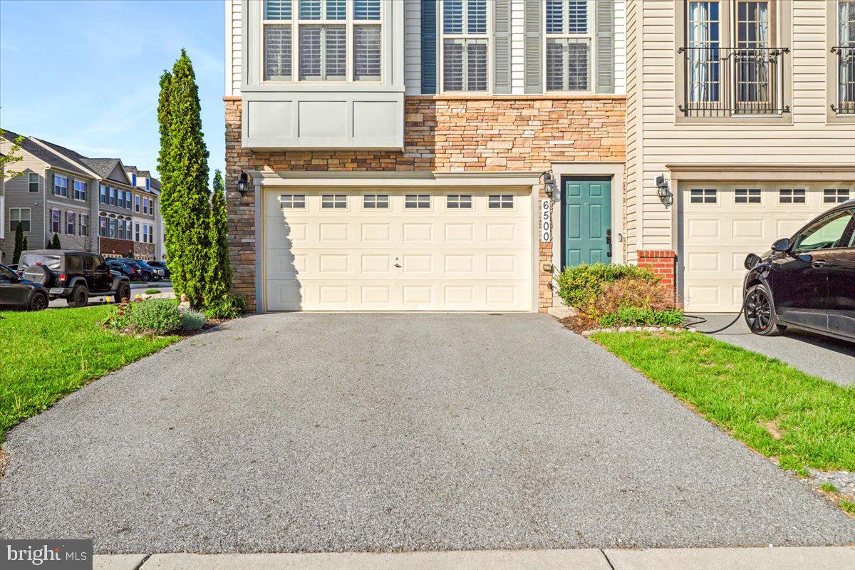 6500 Newton Drive Frederick, MD 21703 - Photo 2 of 36 a view of a house with a yard
