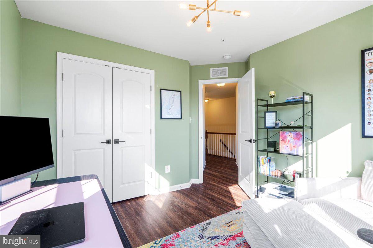 6500 Newton Drive Frederick, MD 21703 - Photo 25 of 36 a bedroom with a bed and a television
