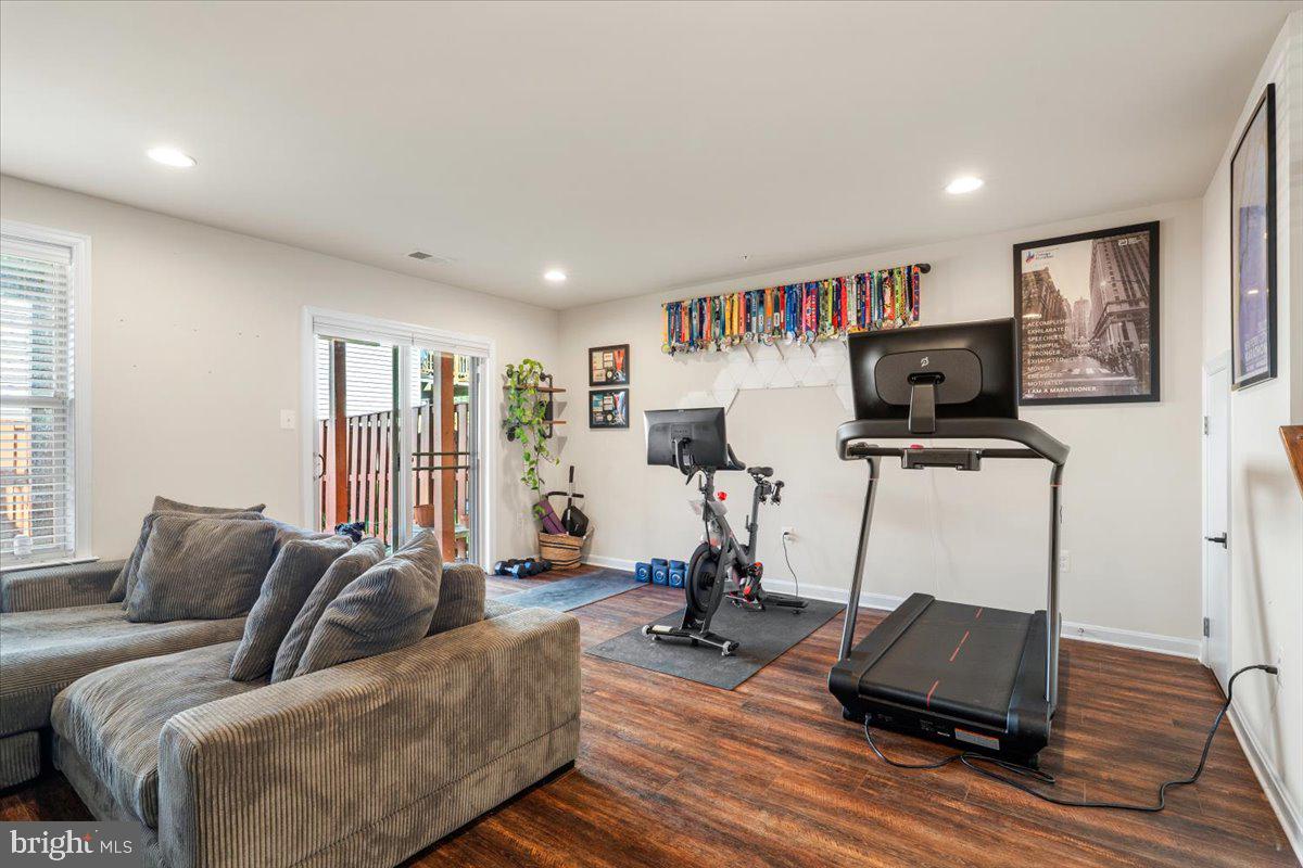 6500 Newton Drive Frederick, MD 21703 - Photo 28 of 36 a living room with furniture and a flat screen tv