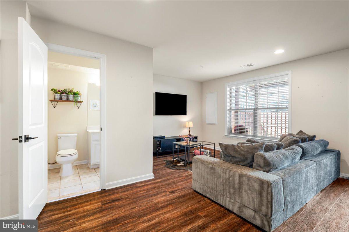 6500 Newton Drive Frederick, MD 21703 - Photo 29 of 36 a living room with furniture and a flat screen tv