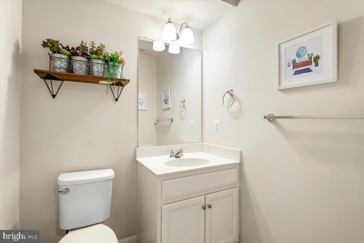 6500 Newton Drive Frederick, MD 21703 - Photo 30 of 36 a bathroom with a sink a toilet and shower