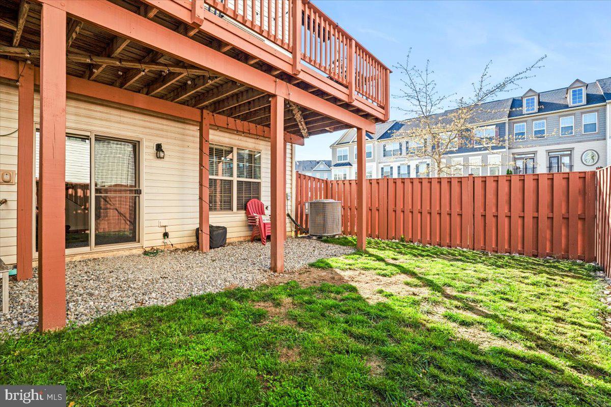 6500 Newton Drive Frederick, MD 21703 - Photo 34 of 36 a view of a backyard with a garden and deck