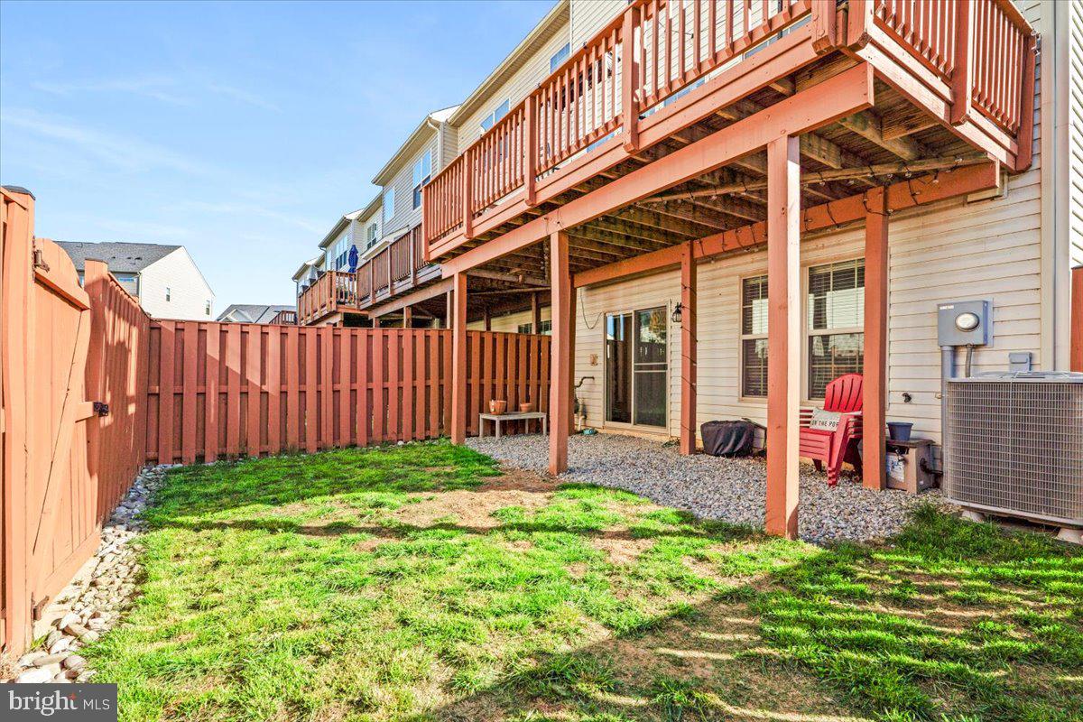 6500 Newton Drive Frederick, MD 21703 - Photo 35 of 36 a view of a house with backyard and porch