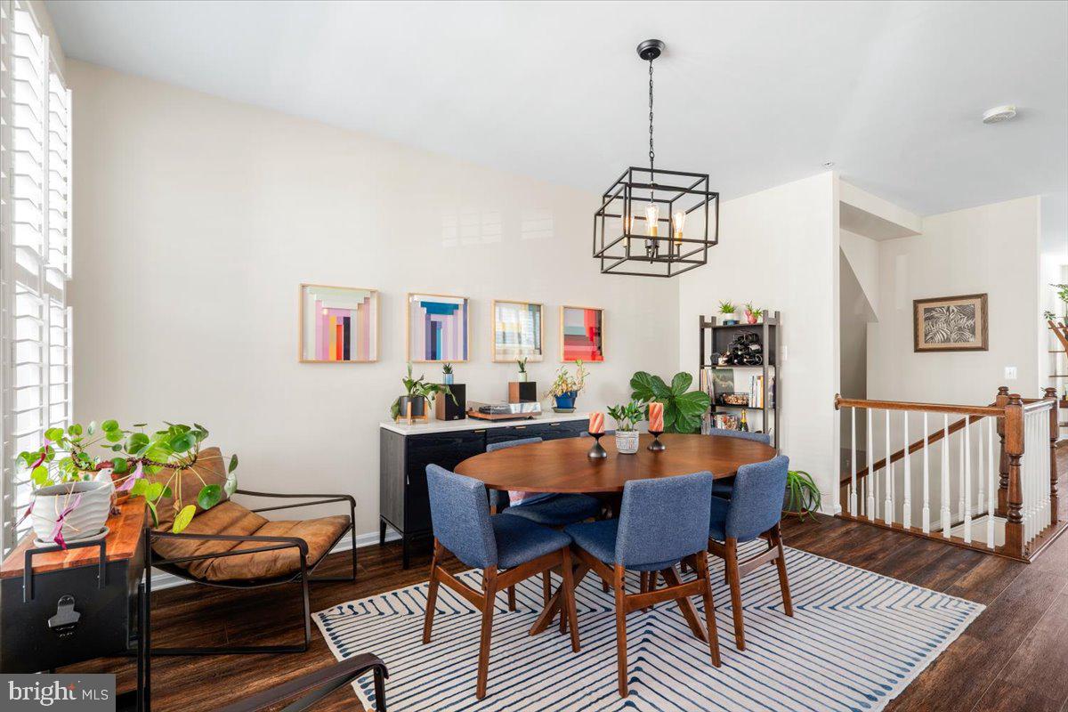 6500 Newton Drive Frederick, MD 21703 - Photo 7 of 36 a view of a dining room with furniture window and wooden floor