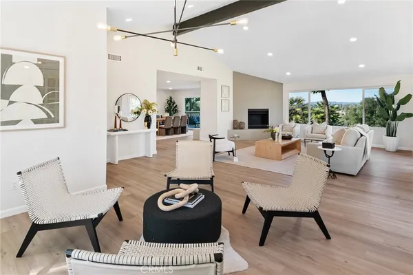 a living room with furniture a rug and a fireplace