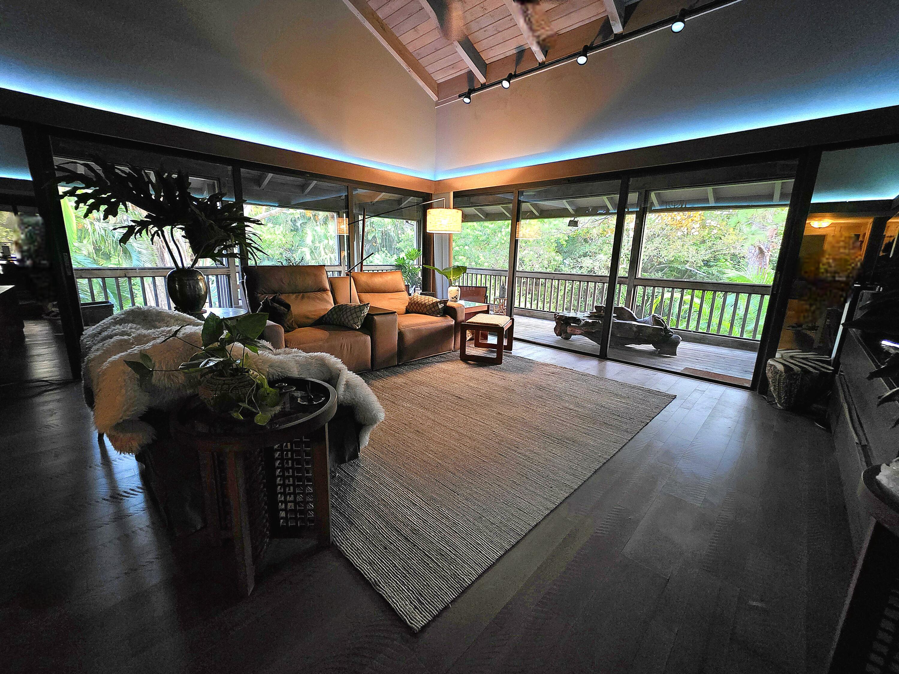 6957 Rain Forest Drive Boca Raton, FL 33434 - Photo 1 of 11 a living room with furniture and large windows
