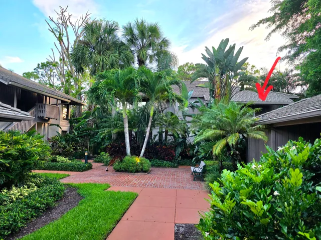 a view of yard with swimming pool and green space