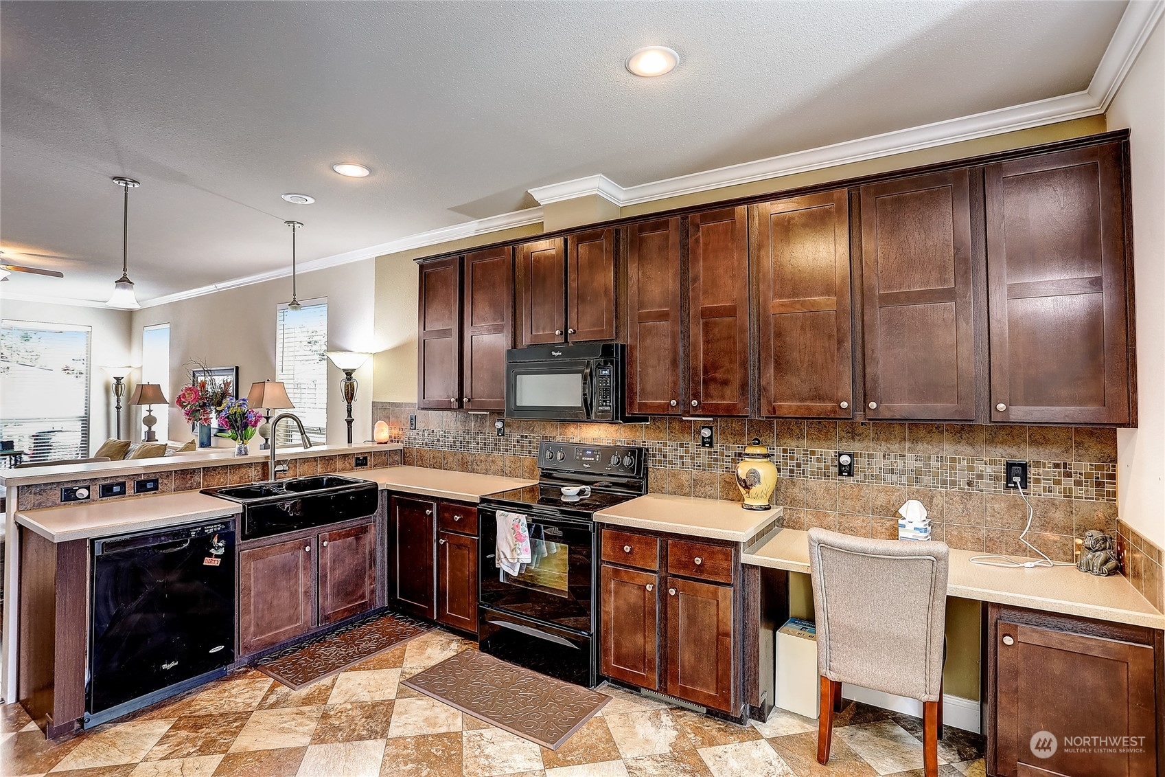 812 Pine Drive Enumclaw, WA 98022 - Photo 11 of 26 a kitchen with a sink stove and cabinets