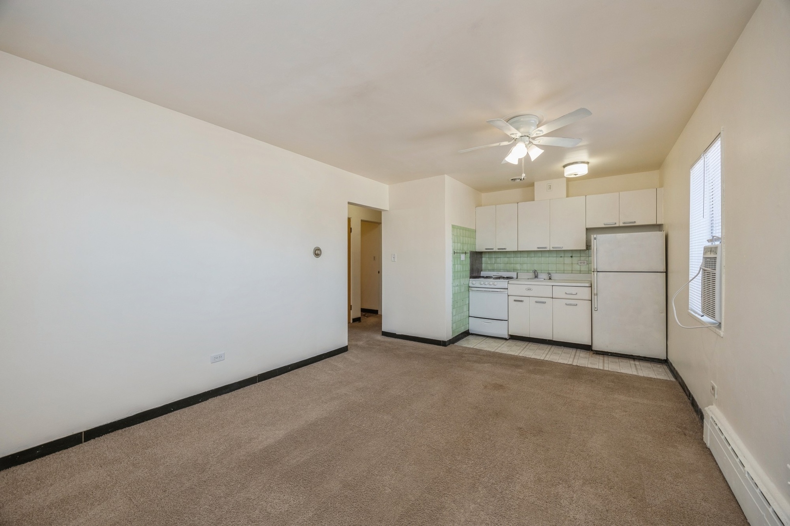 148 Ann Street, Unit 11 Clarendon Hills, IL 60514 - Photo 3 of 11 a view of a kitchen with a sink cabinets and entryway
