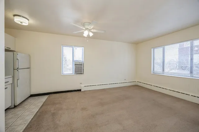 a view of an empty room with a window