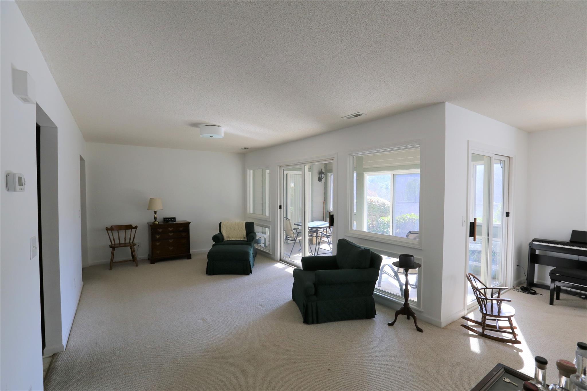 125 Burning Tree Lane Flat Rock, NC 28731 - Photo 4 of 15 a living room with furniture and gym equipment