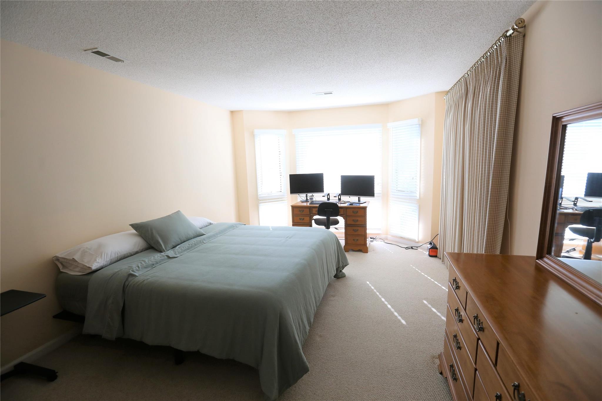 125 Burning Tree Lane Flat Rock, NC 28731 - Photo 6 of 15 a bed room with a bed and a large window