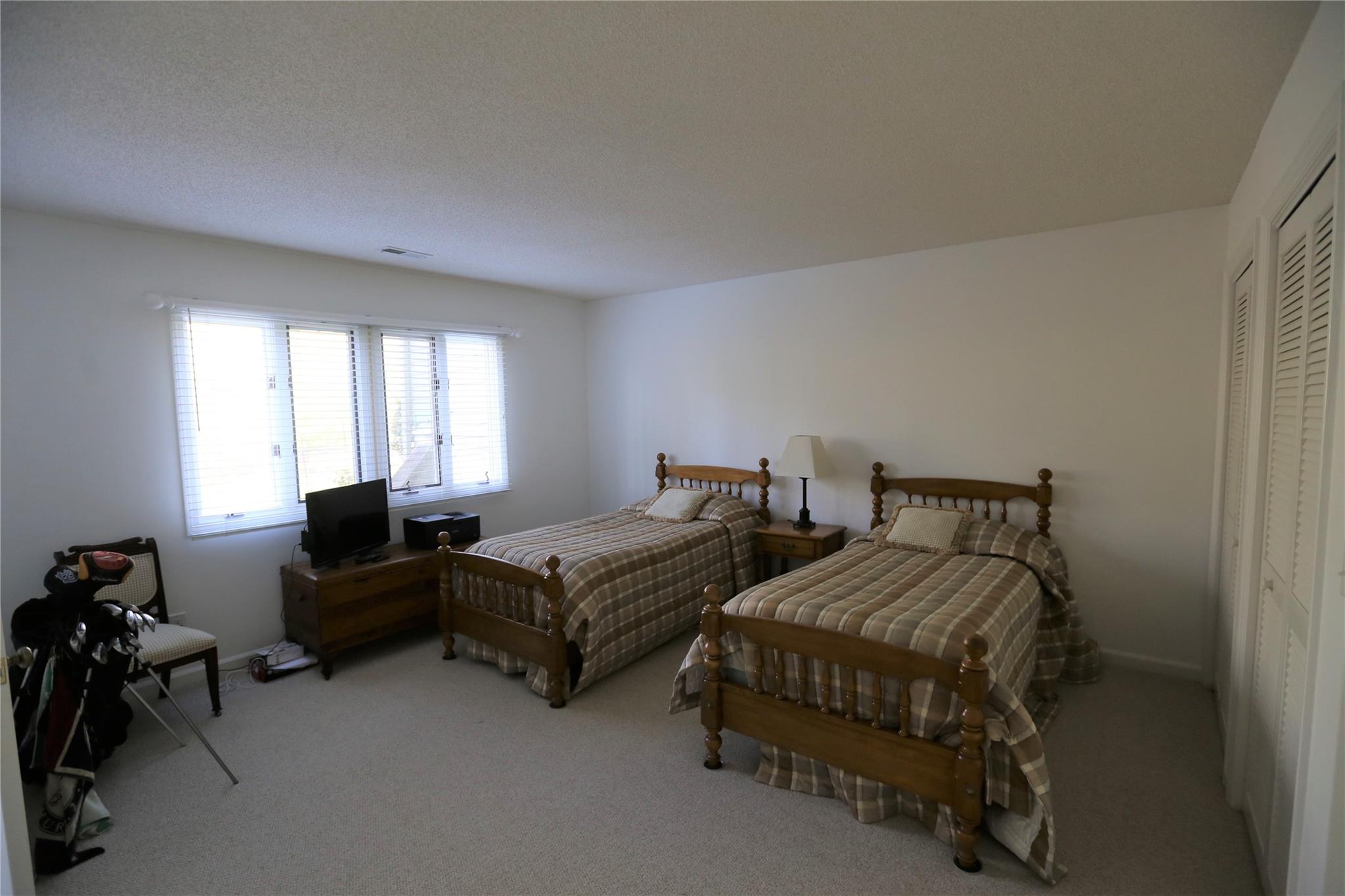 125 Burning Tree Lane Flat Rock, NC 28731 - Photo 7 of 15 a bedroom with two beds and a couch