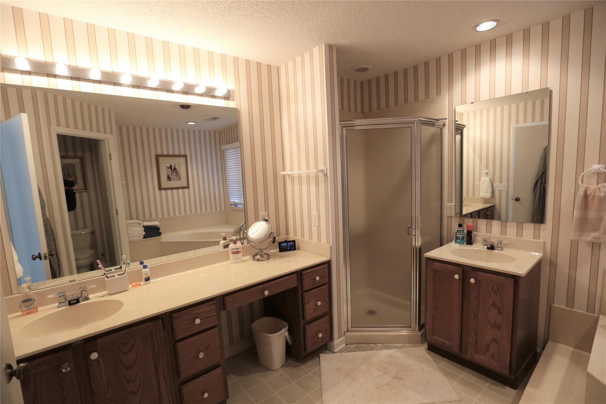 125 Burning Tree Lane Flat Rock, NC 28731 - Photo 8 of 15 a spacious bathroom with double vanity and a mirror