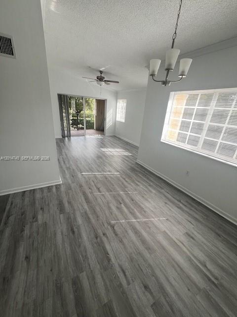2103 Renaissance Boulevard, Unit 307 Miramar, FL 33025 - Photo 6 of 25 an empty room with wooden floor and windows