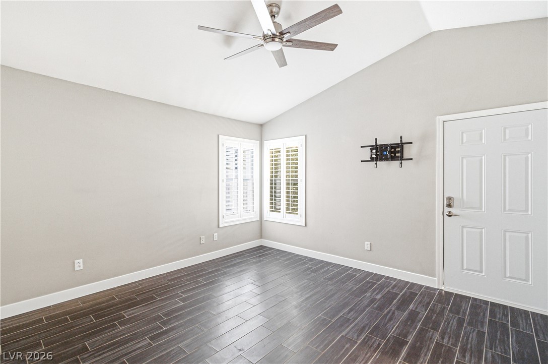 9523 Observer Street Las Vegas, NV 89123 - Photo 26 of 42 A quiet, well-lit room offers vaulted ceilings, sleek tile flooring, and clean window shutters.