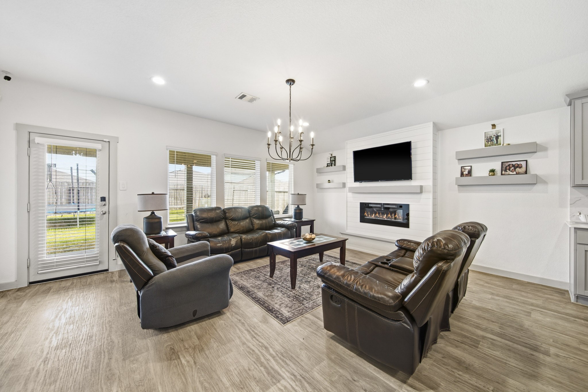 8210 Buck Lane Rosharon, TX 77583 - Photo 9 of 30 Bright living room with large windows and direct access to the backyard.