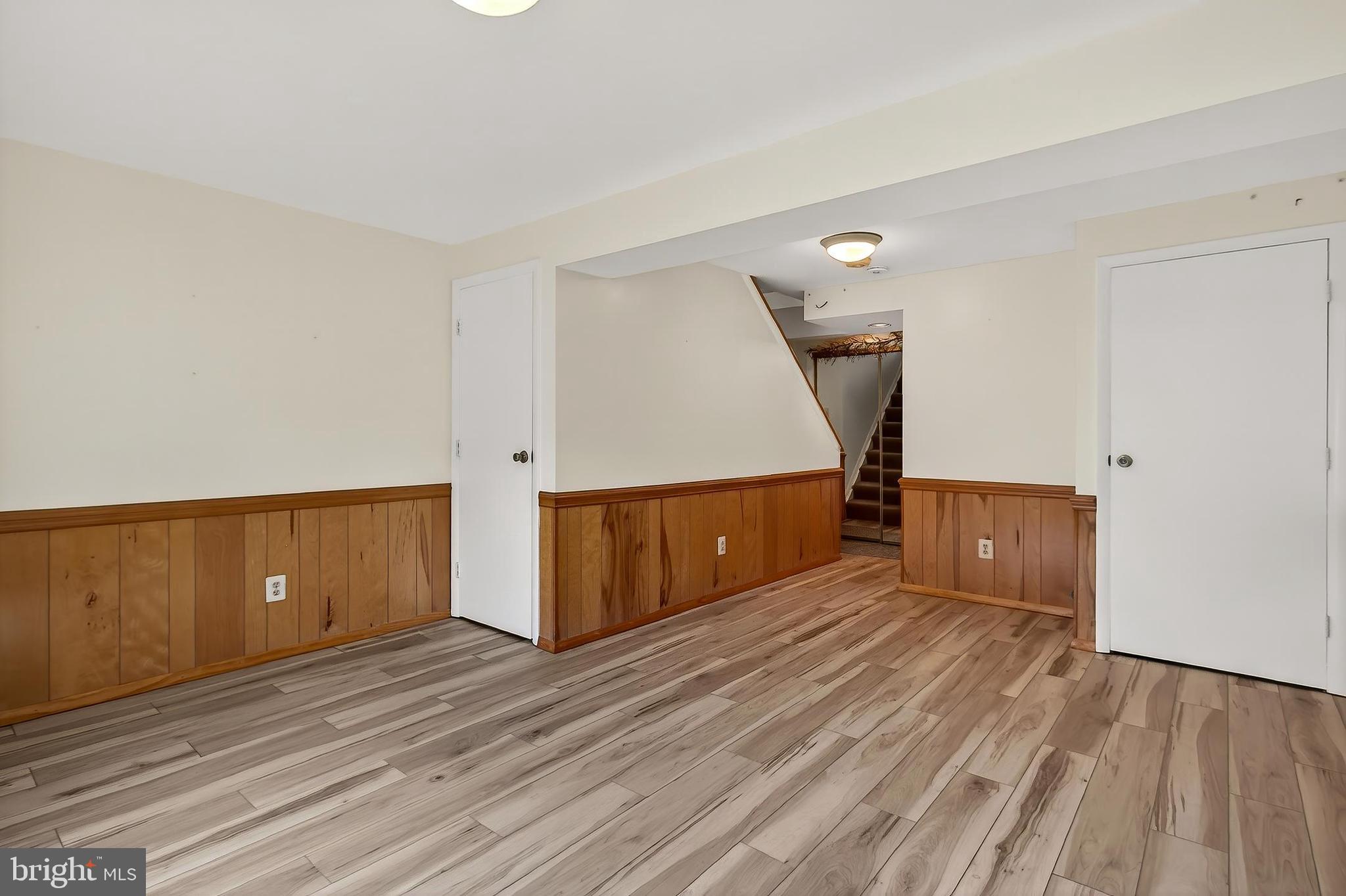 8353 Bark Tree Court Springfield, VA 22153 - Photo 12 of 32 Updated LVP Flooring in Rec Room