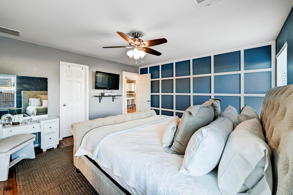 280 Spruce Drive Kyle, TX 78640 - Photo 16 of 30 Bedroom featuring wood finished floors and a ceiling fan