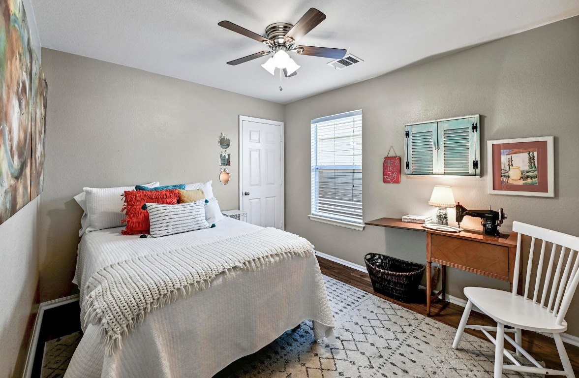 280 Spruce Drive Kyle, TX 78640 - Photo 19 of 30 Bedroom with wood finished floors and ceiling fan