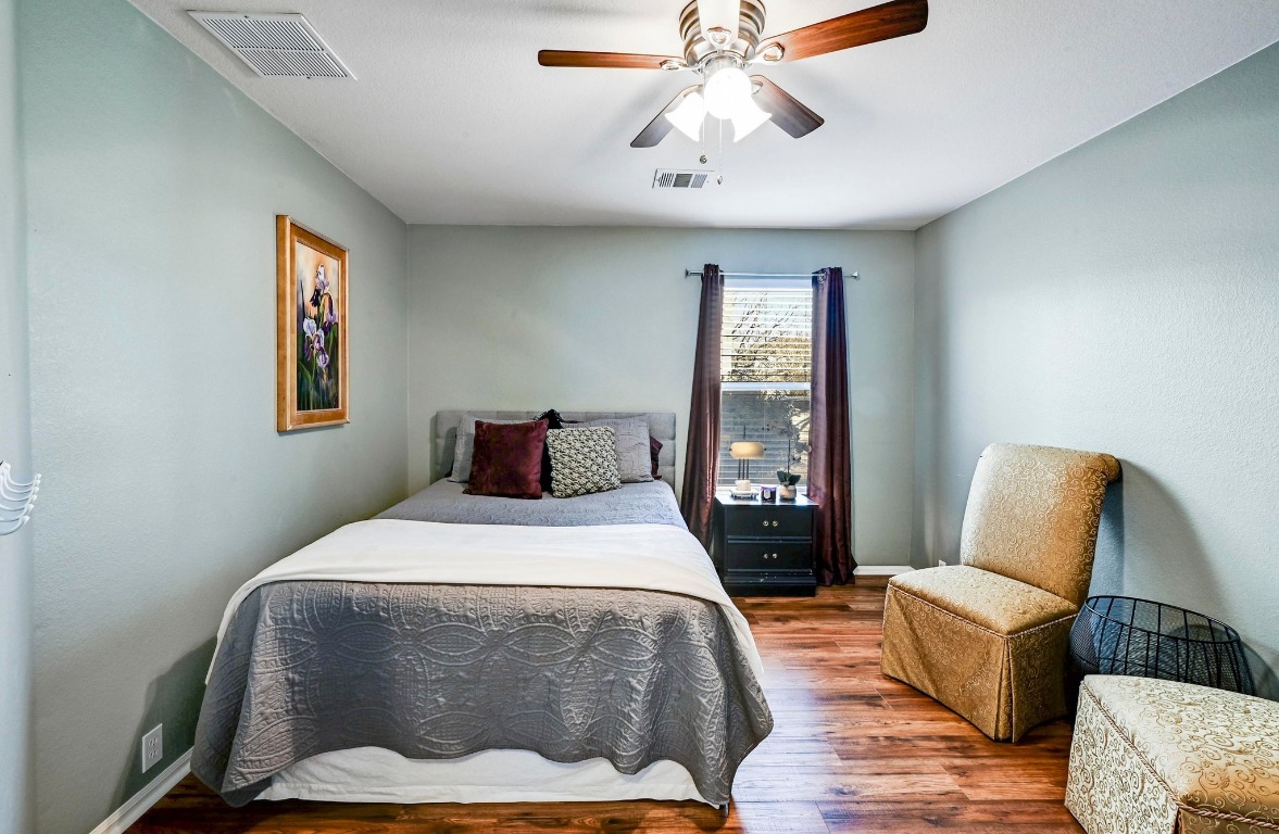 280 Spruce Drive Kyle, TX 78640 - Photo 20 of 30 Bedroom with ceiling fan and wood finished floors
