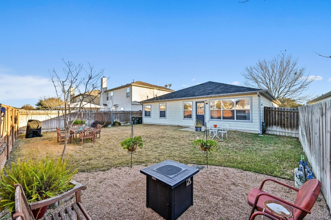 280 Spruce Drive Kyle, TX 78640 - Photo 23 of 30 Rear view of property featuring a patio and a fenced backyard