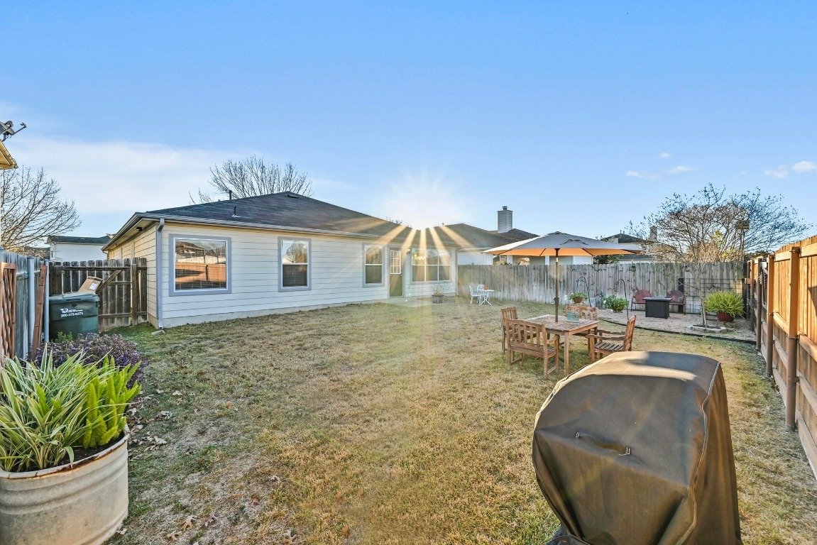 280 Spruce Drive Kyle, TX 78640 - Photo 25 of 30 Back of property featuring a fenced backyard and a patio area
