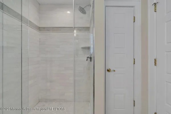 a front view of a house with a yard and green space